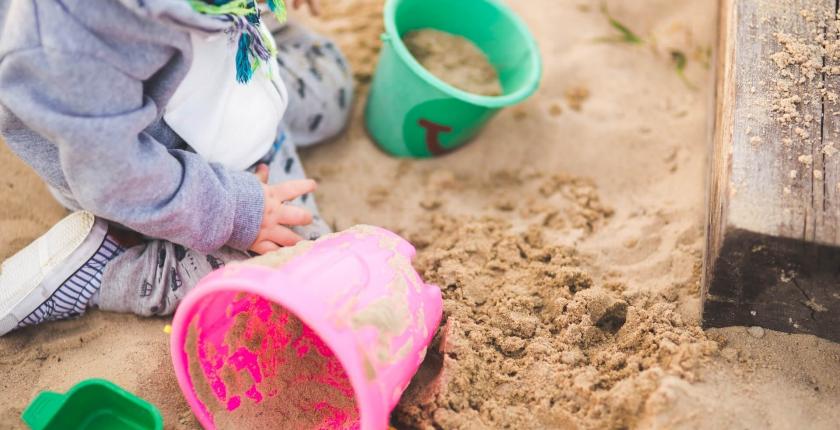 Child playing in a sand pit